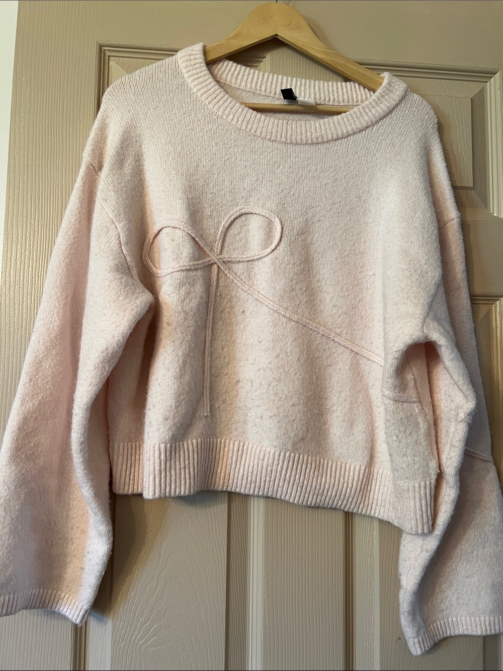 Divided Light Pink Crewneck Sweater with Bow Detail